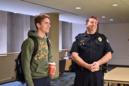 Lt Michael Coss at Coffee with a Cop Talking to Student