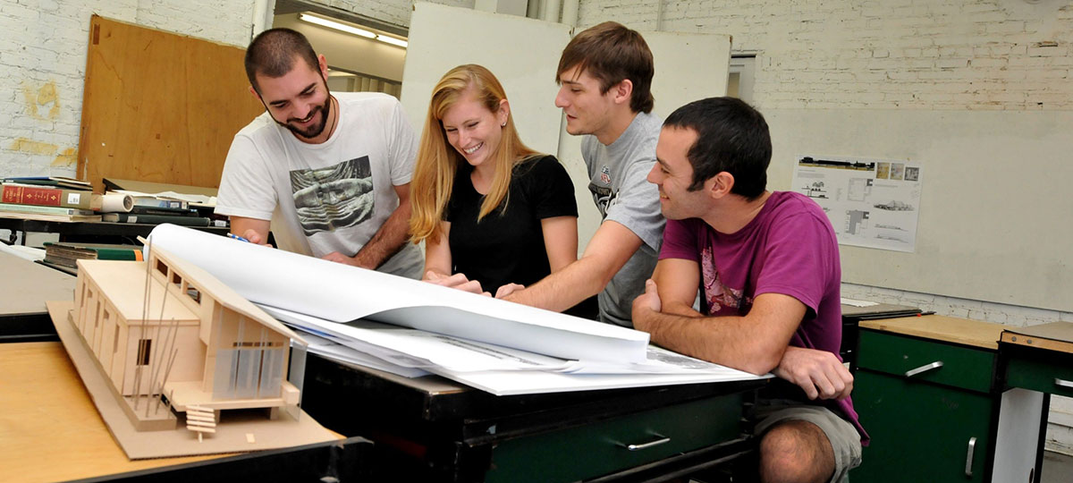 Architectural Technology students reading blueprints