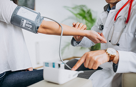 Doctor and patient getting blood pressure 