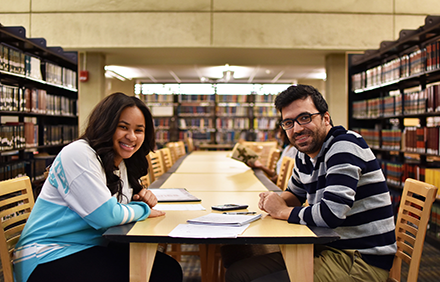 Tutor and Student working in the library