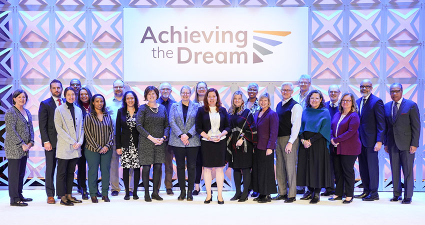 Sinclair Community College Board of Trustees members, faculty, and staff accept the Leah Meyer Austin Award in Chicago on February 16, 2023.