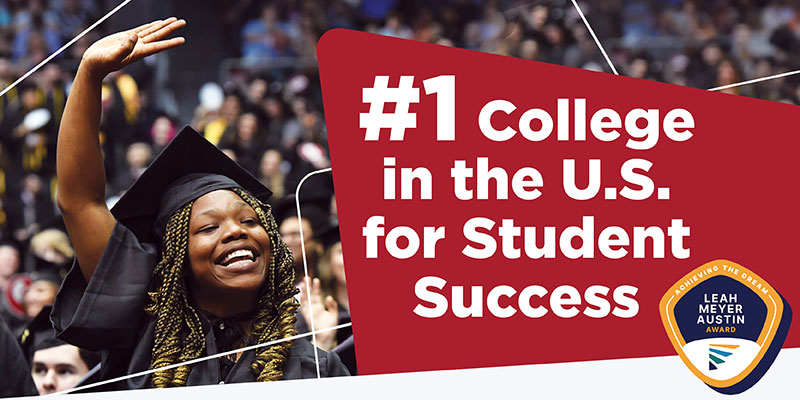 A smiling and waving female graduate next to the words #1 College in the U.S. for Student Success