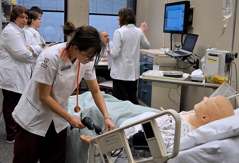 Nursing Student Practicing Checking Stats