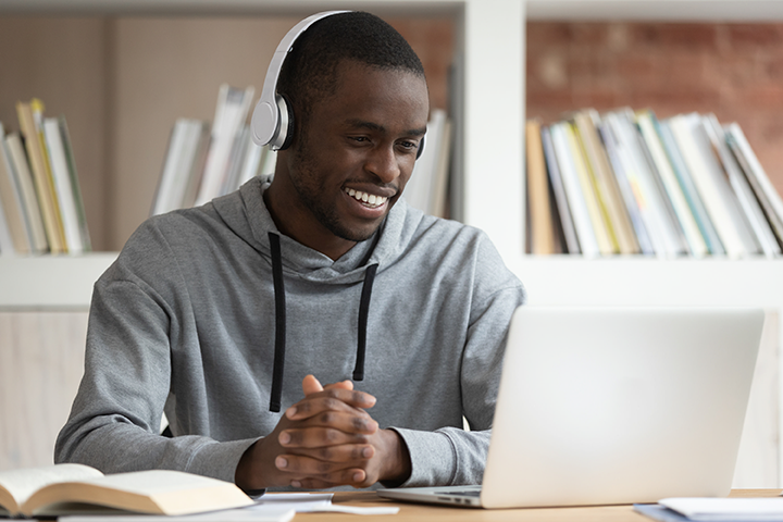 image of a male working at a computer for clas