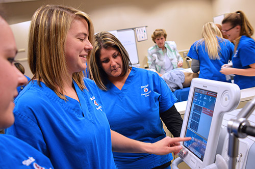 Students working durning a nursing lab