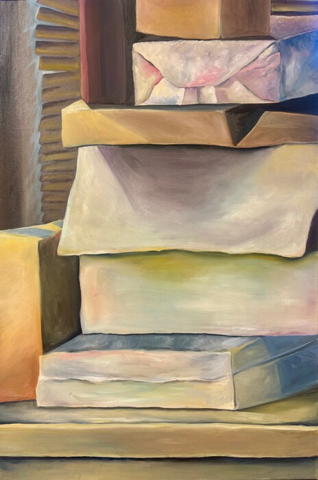 A stack of different sized boxes, some wrapped, some plain cardboard, and some varied in colors. The image is zoomed so the boxes are cropped so only the front and some of the side can be seen.