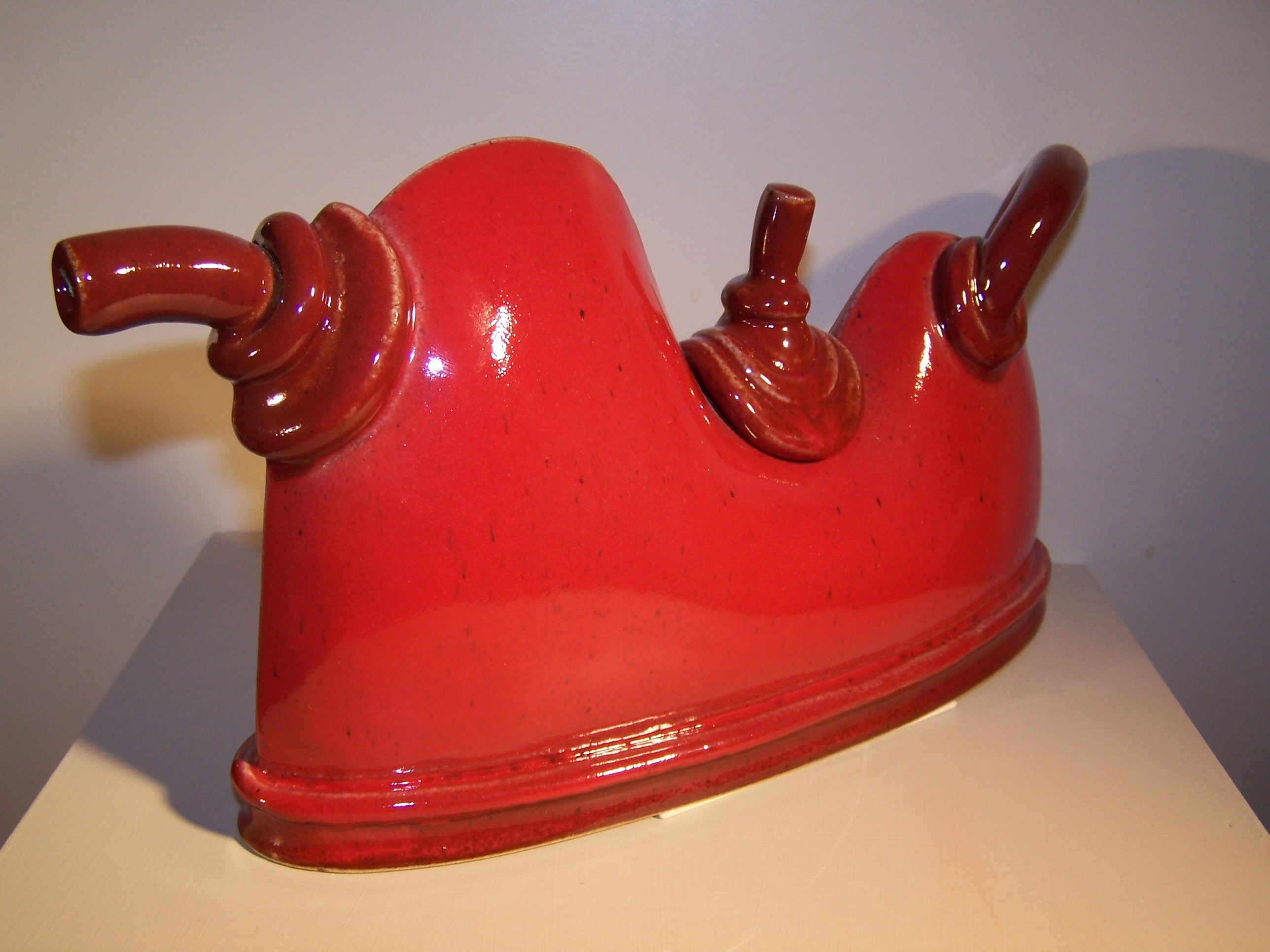 This art piece is named ‘Red Teapot' 