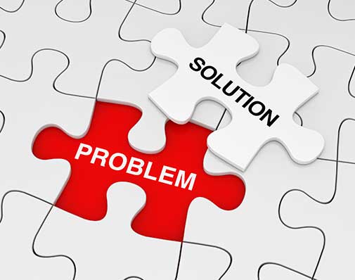 An image of a puzzle with a piece out of place; the piece says solution and the space where the puzzle needs to go says problem