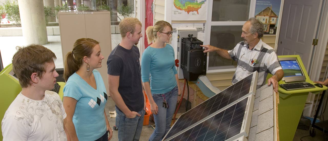 Energy management Tech students learn about solar panels.