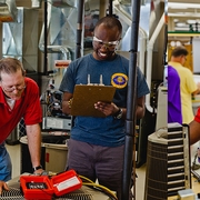 Students Practice Working on an Air-conditioner